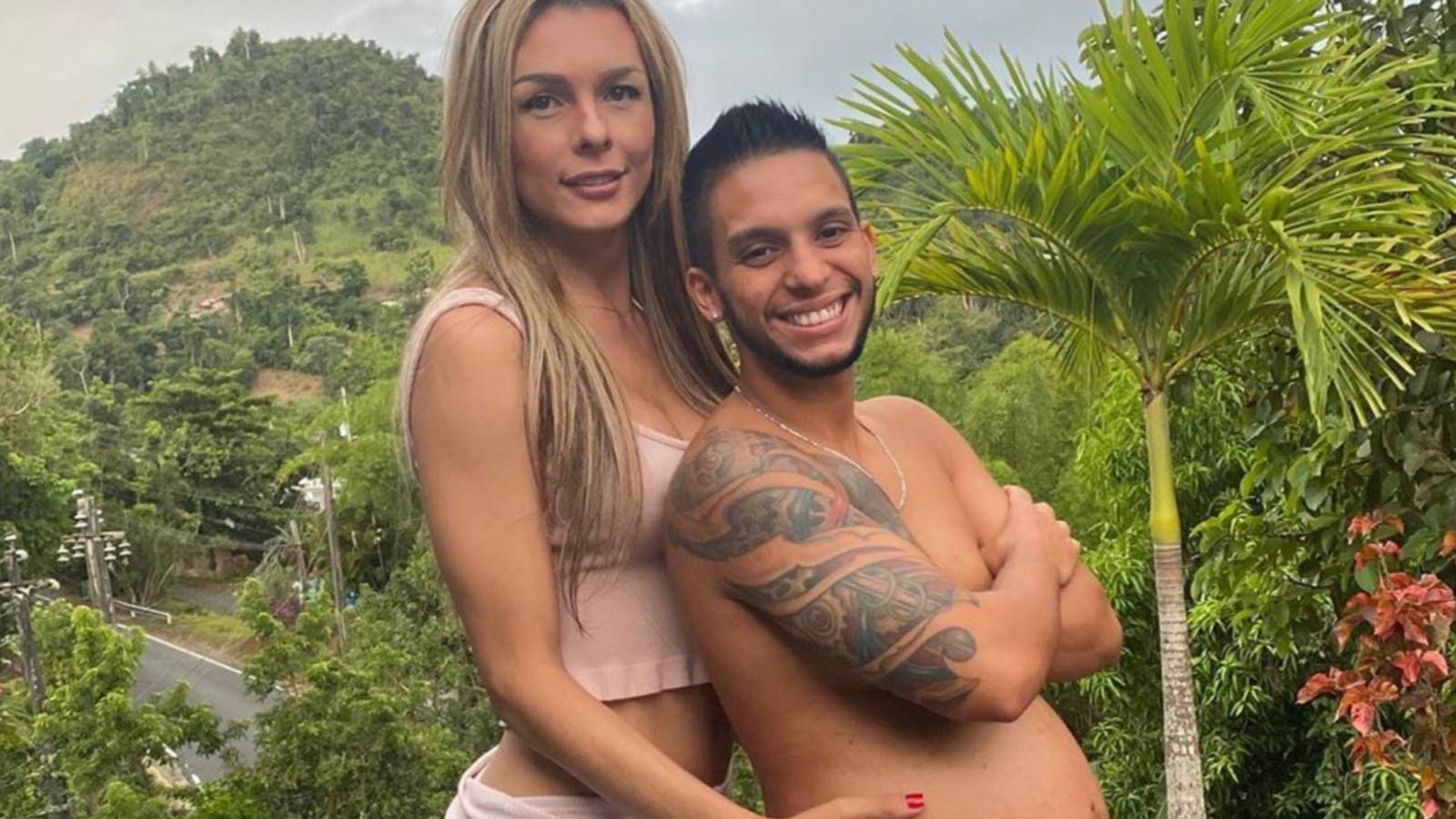 Transgender Model Goes Viral For Kissing Her Husband's 8-Month Baby Bump In Sweet Photo