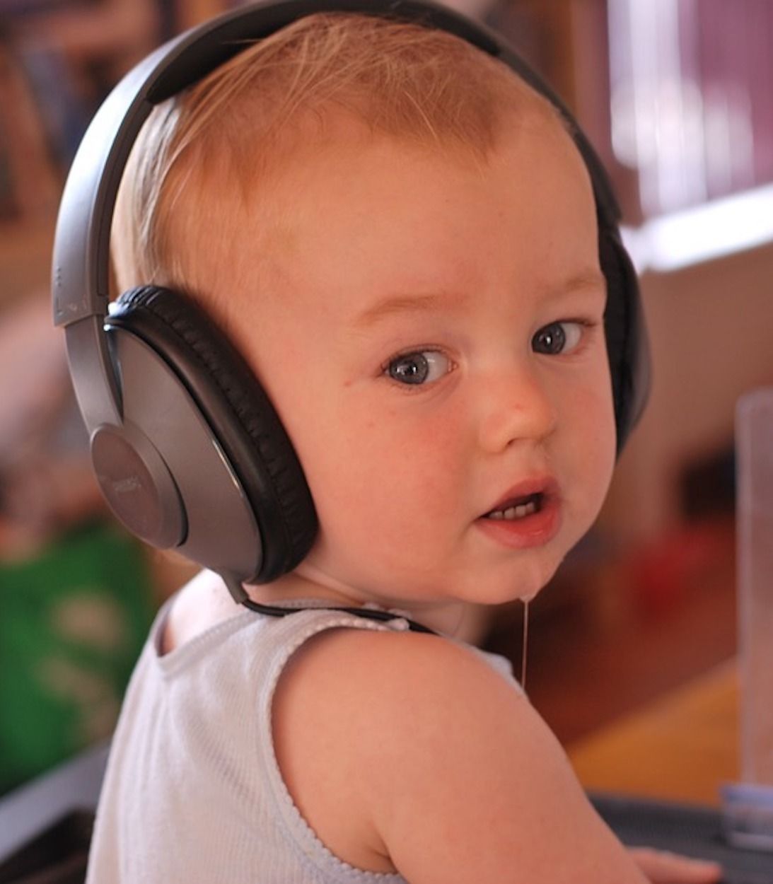 toddler with headphones on