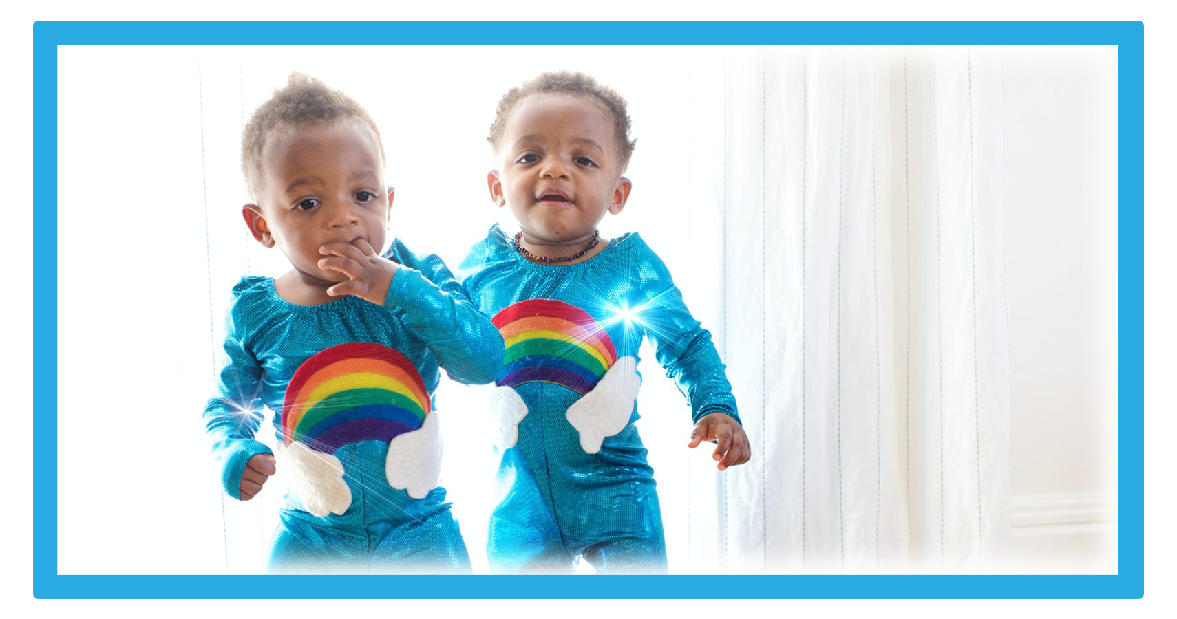 Twin Boys In Cute Rainbow Outfits.