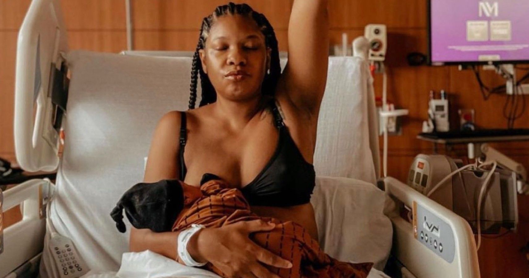 Woman Proudly Nursing Baby After Giving Birth