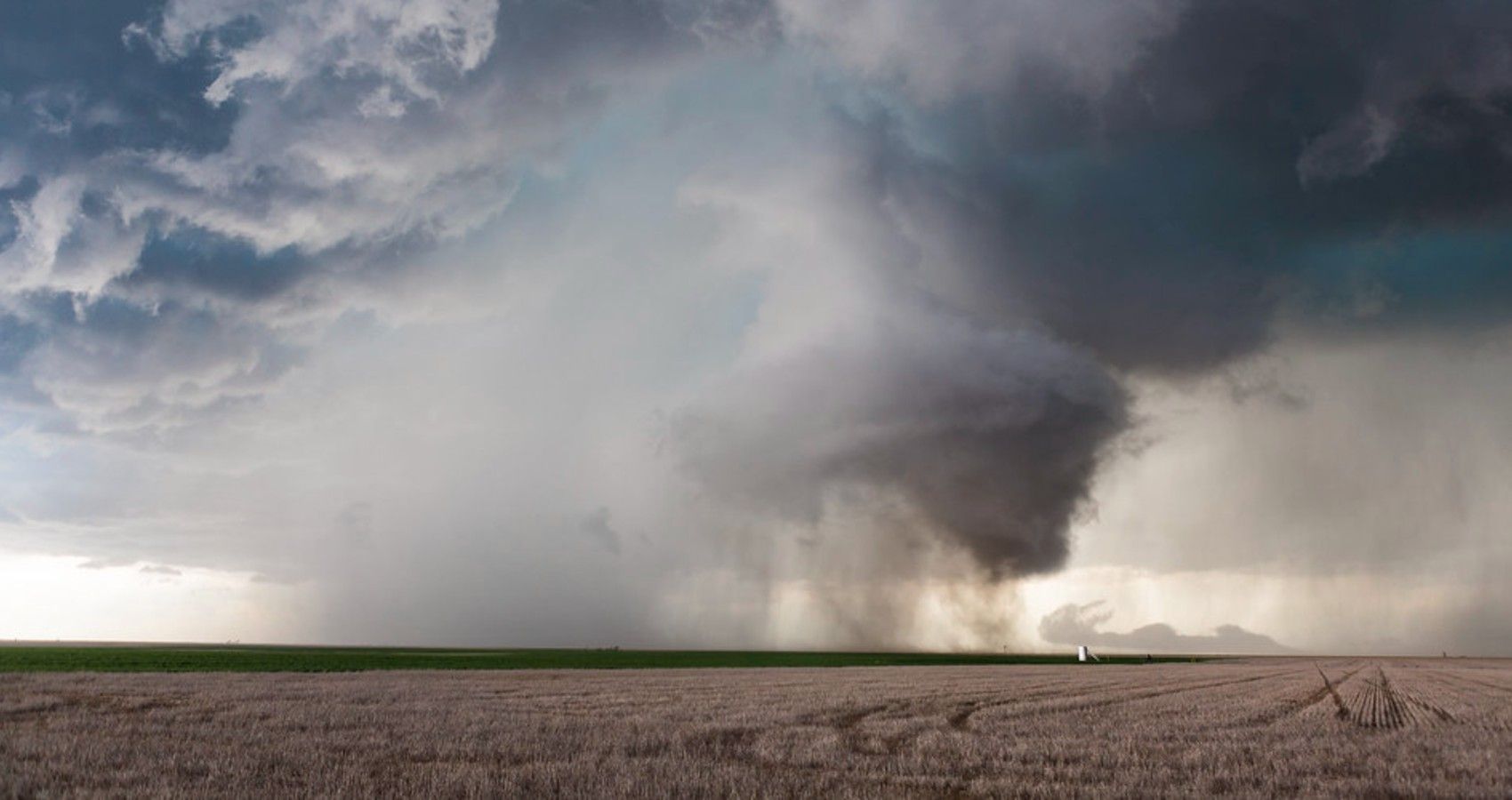 A picture of a tornado in the distance