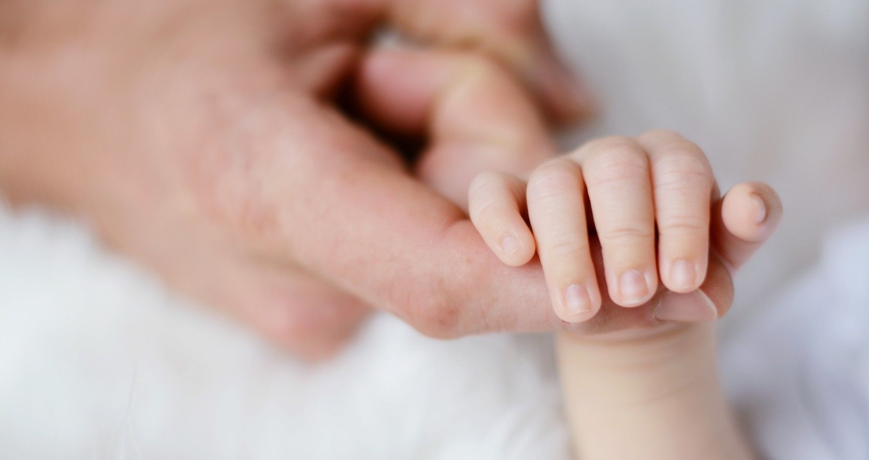 New Study Looks At Why Infants Seem _Protected_ Against COVID-19