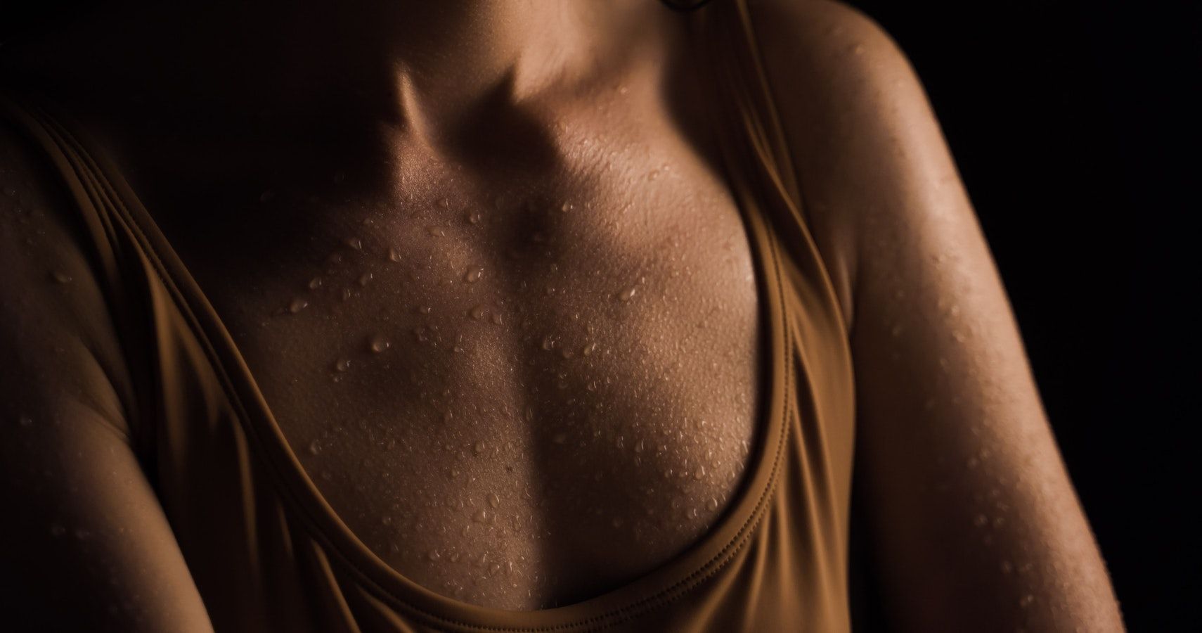 Photo of a woman's chest with sweat