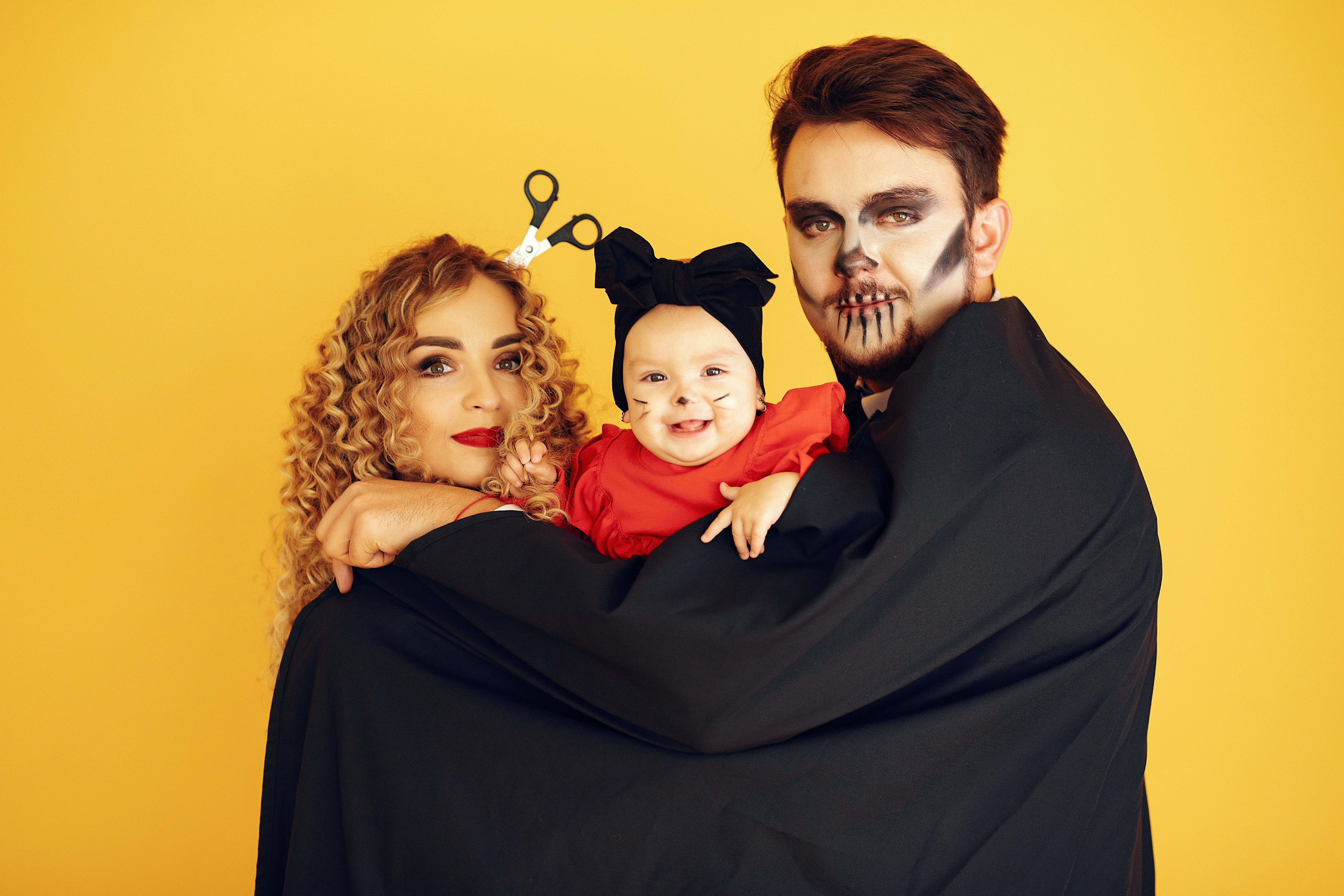 parents and baby in costume