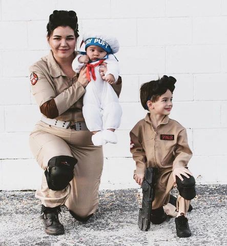 Mother, son, and baby dressed up as characters from Ghostbusters movie