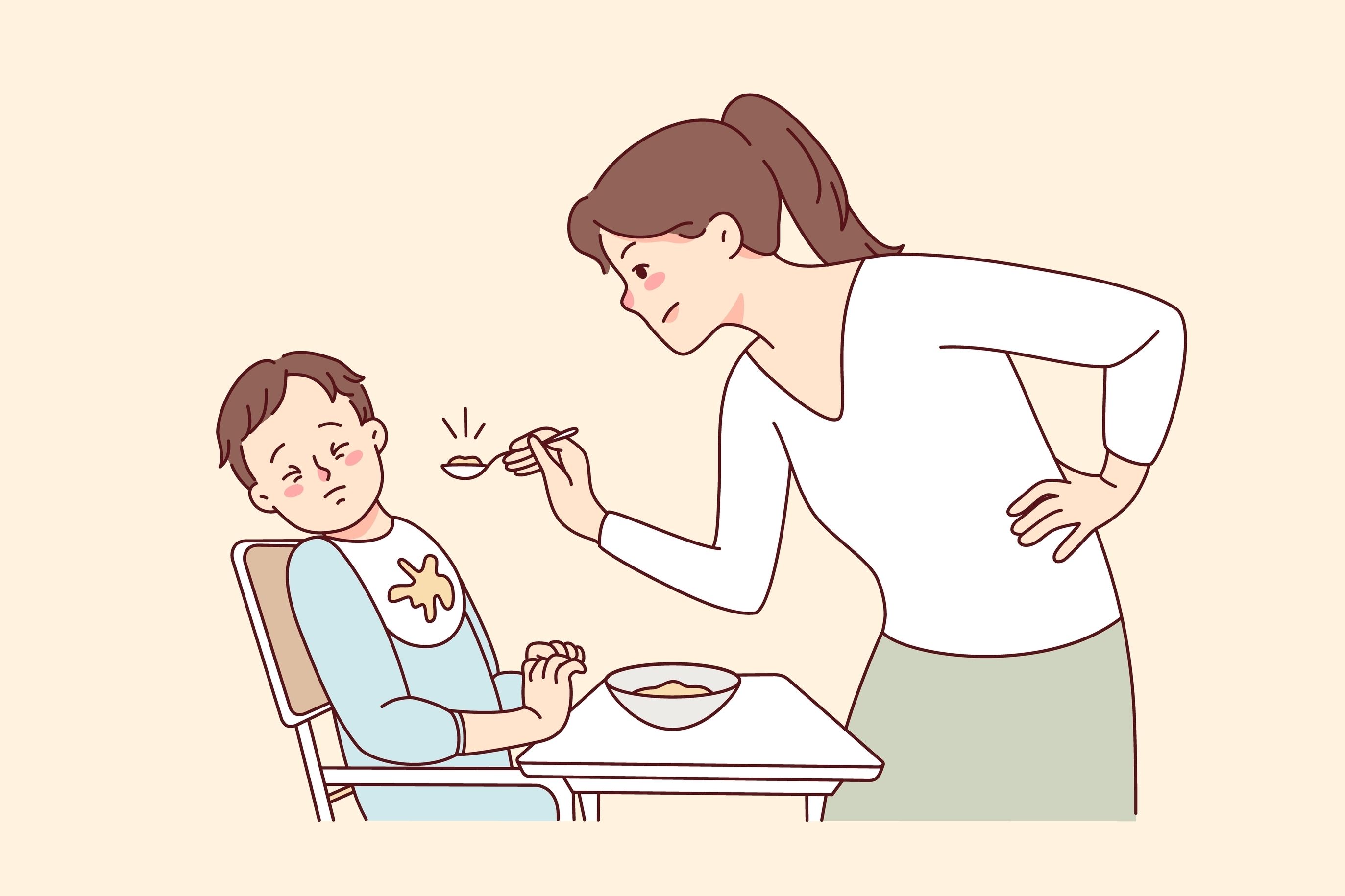 mom trying to feed toddler in high chair