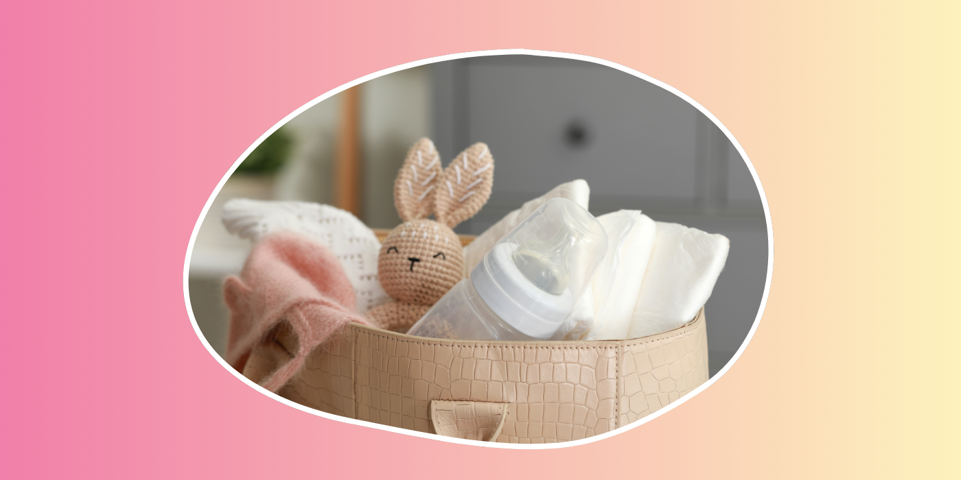 pink and yellow background with a pink diaper bag and bunny