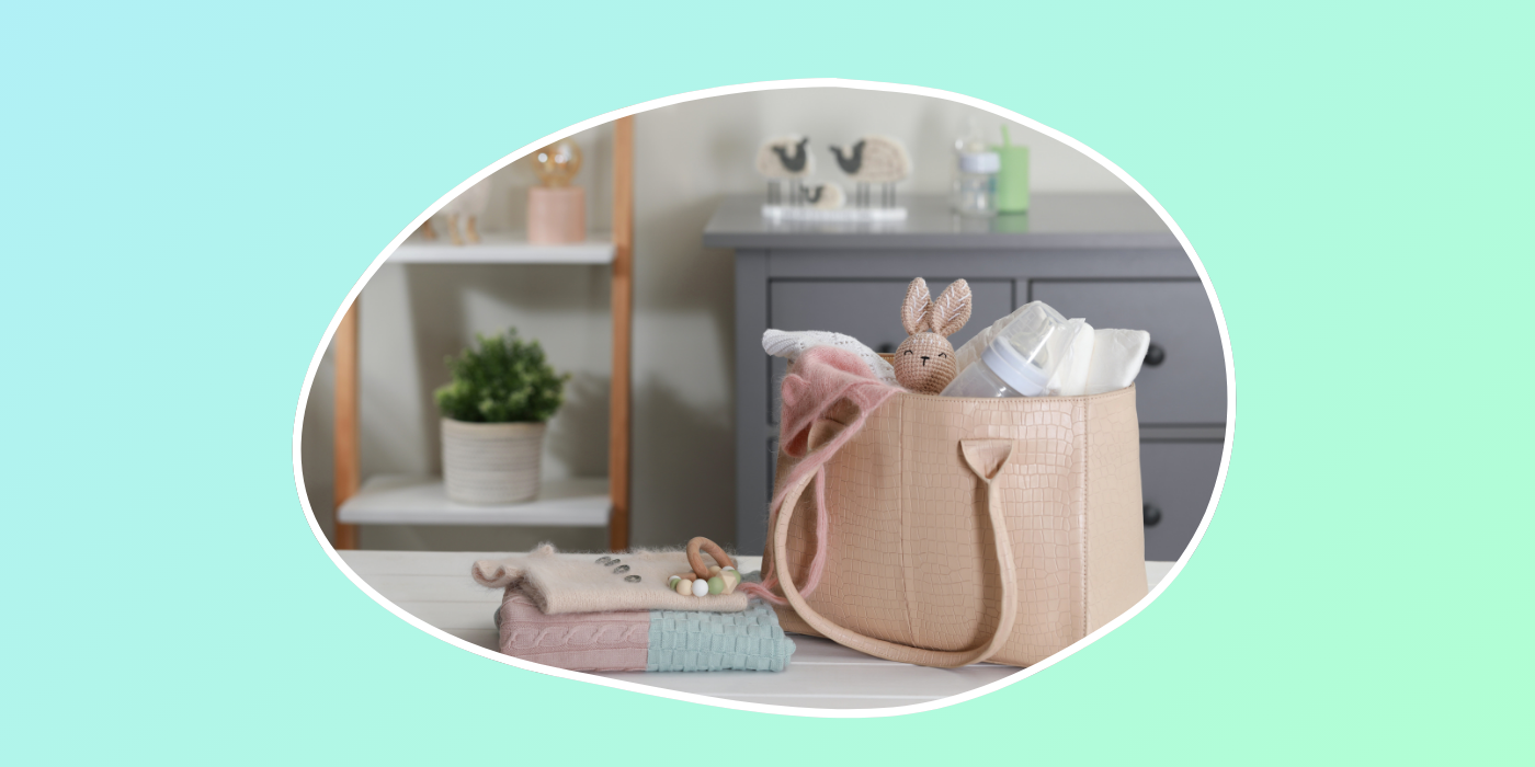 green background with a pink diaper bag